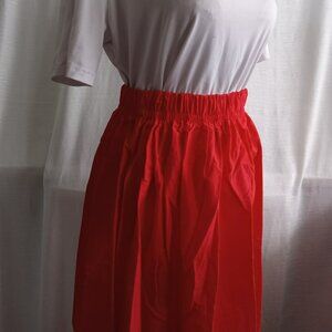 Beautiful long red skirt with sequins at the bottom, cotton and polyester